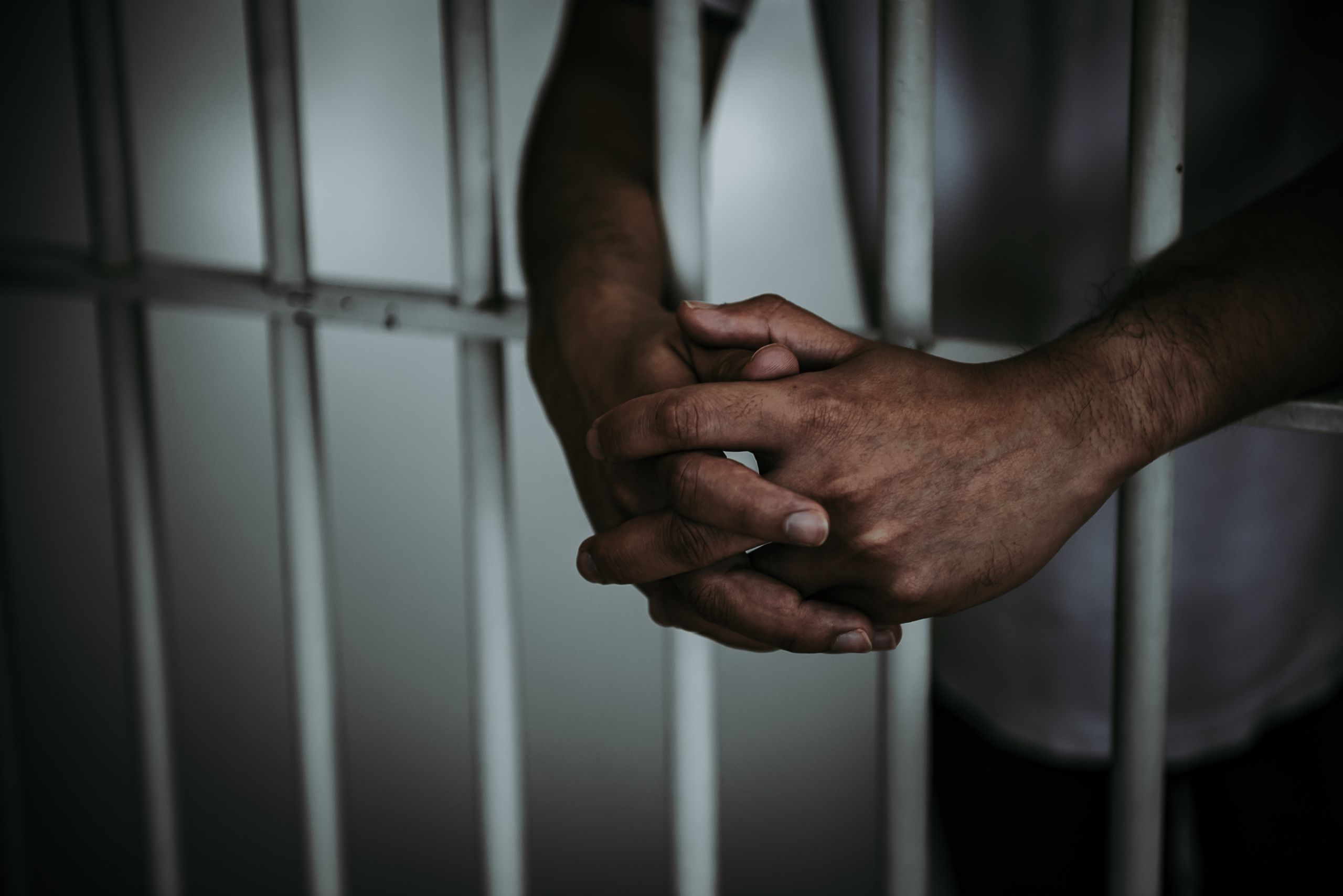 hands-men-desperate-catch-iron-prisonprisoner-conceptthailand-peoplehope-be-free-1-scaled